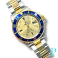 40MM ROLEX SUBMARINER (ANNIVERSARY “SERTI” DIAL) 18KT GOLD / STAINLESS STEEL TWO-TONE / OYSTER BRACELET / AUTOMATIC / DIAMOND AND SAPPHIRE SET HOUR MARKERS