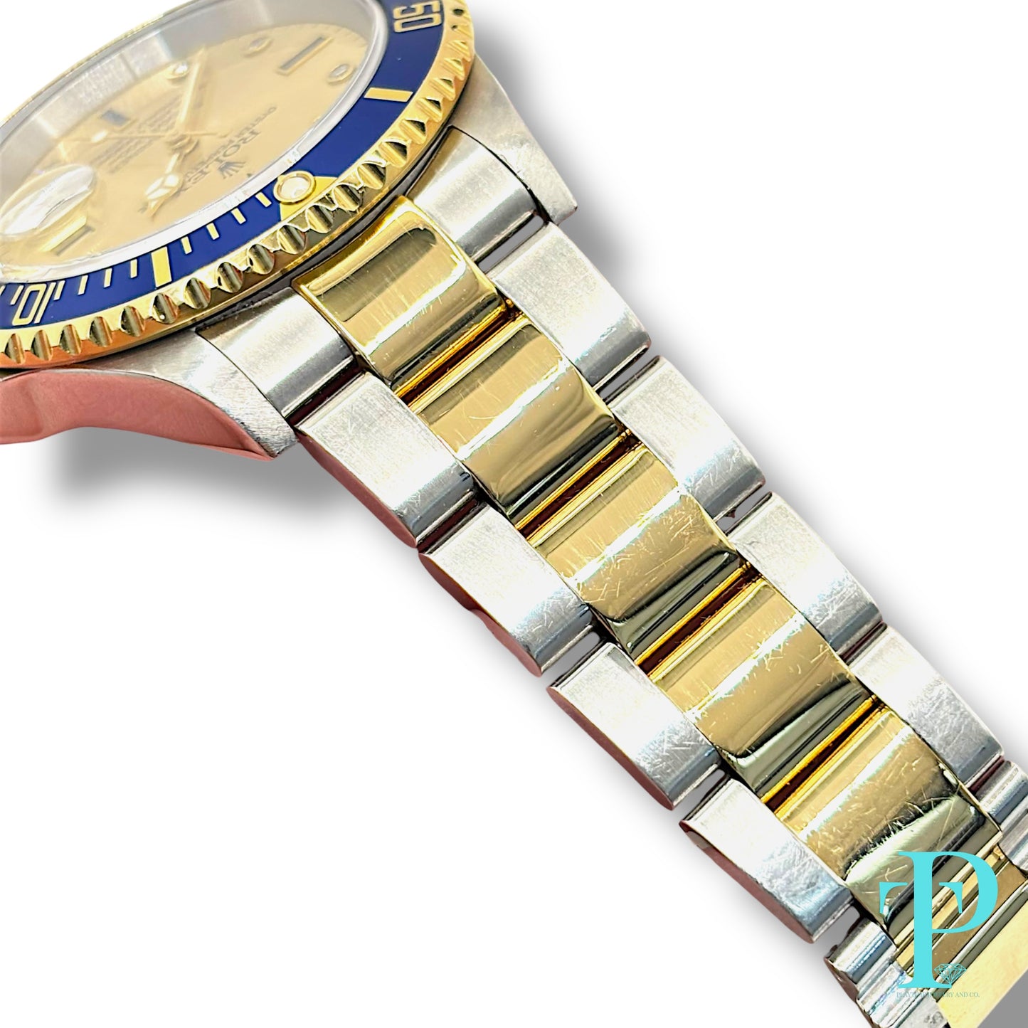 40MM ROLEX SUBMARINER (ANNIVERSARY “SERTI” DIAL) 18KT GOLD / STAINLESS STEEL TWO-TONE / OYSTER BRACELET / AUTOMATIC / DIAMOND AND SAPPHIRE SET HOUR MARKERS