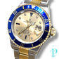 40MM ROLEX SUBMARINER (ANNIVERSARY “SERTI” DIAL) 18KT GOLD / STAINLESS STEEL TWO-TONE / OYSTER BRACELET / AUTOMATIC / DIAMOND AND SAPPHIRE SET HOUR MARKERS